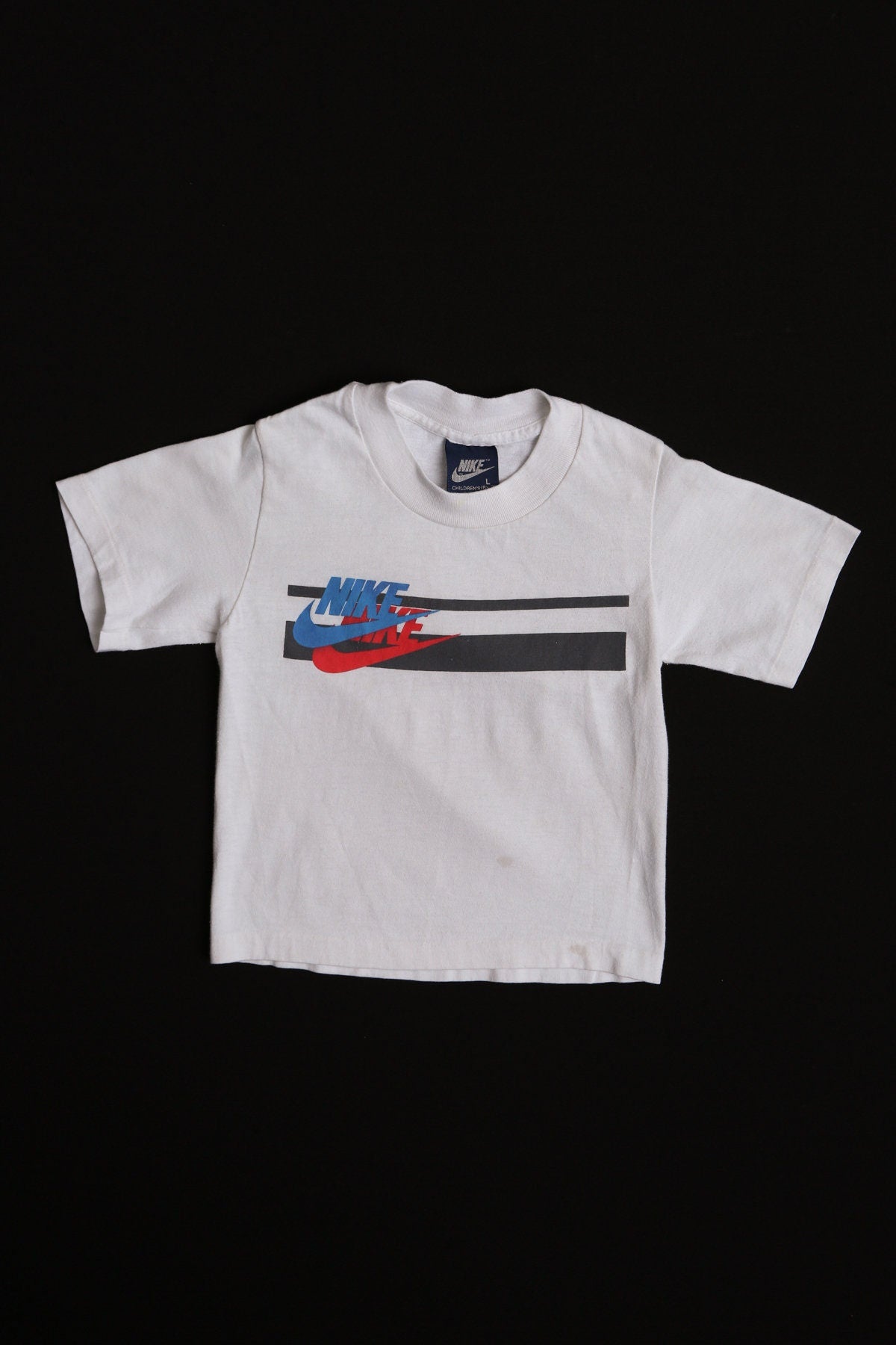 Vintage Children Nike White Graphic T-shirt - Blue Label - Striped - Era 80's -90's