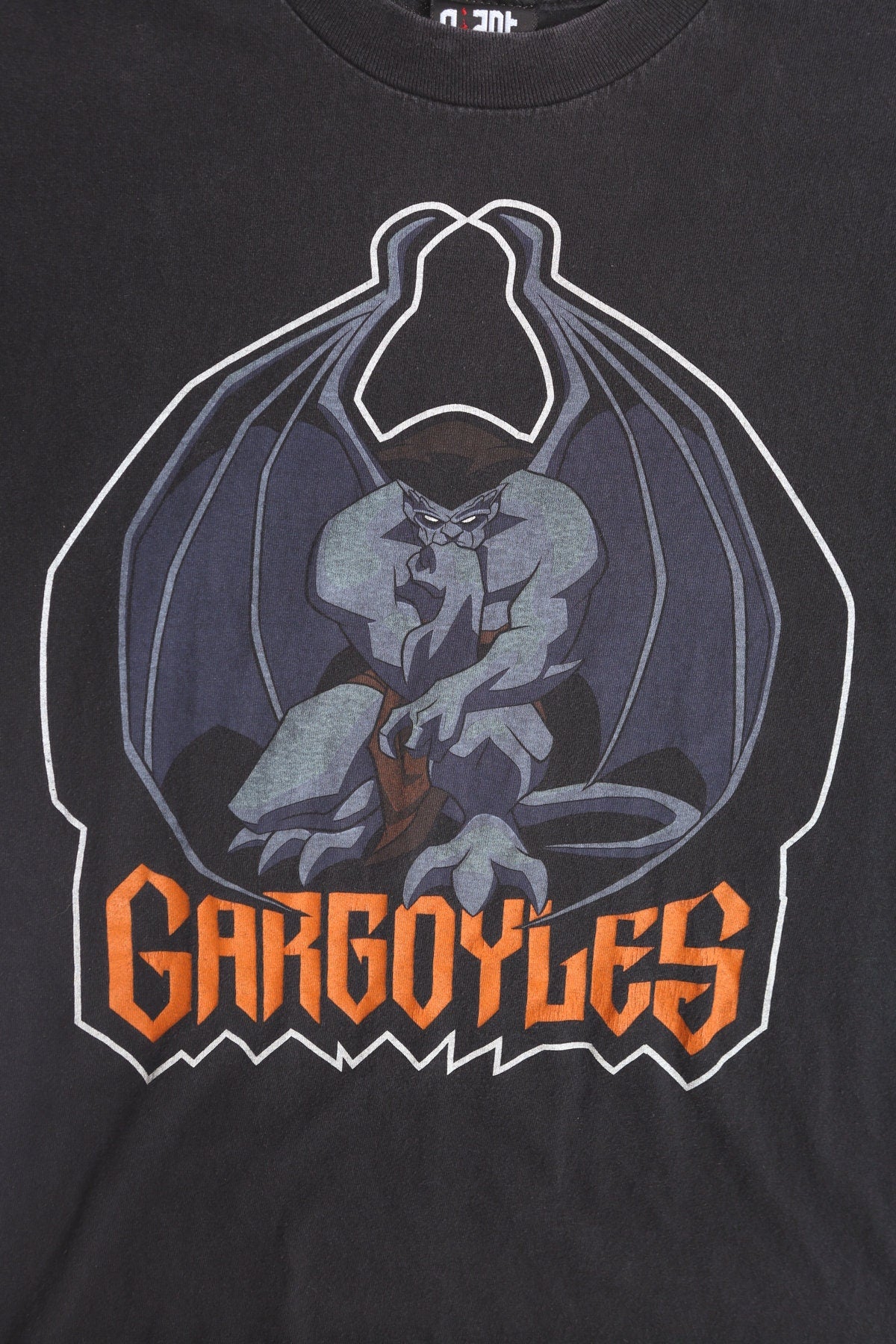 Gargoyles Cartoon Graphic T-shirt - Giant T-shirt Label - Stone by Day, Warriors by Night